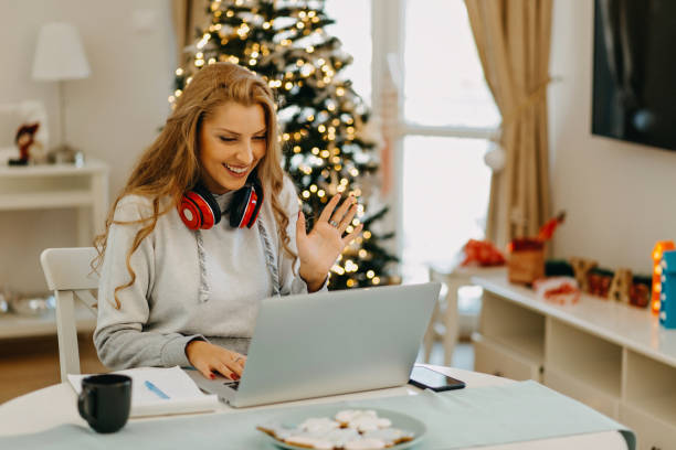 istock Young woman working from home during Christmas 1287247760