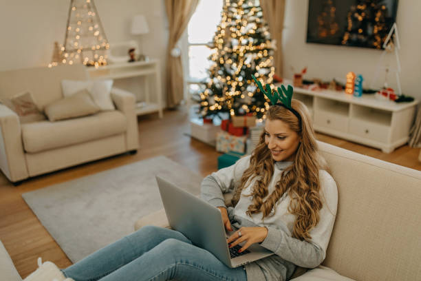 istock Young woman working from home during Christmas 1287247762