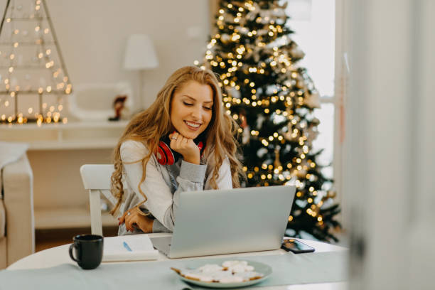 istock Young woman working from home during Christmas 1287247790