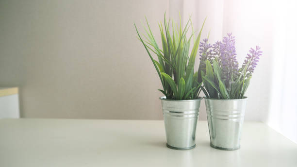 istock Artificial plants or fake tree on white table for decoration. 1287248721