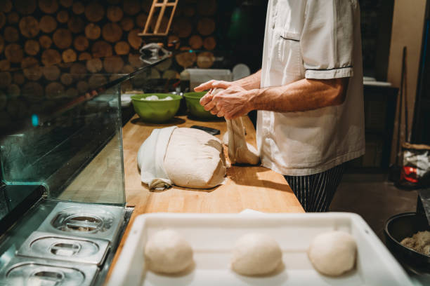 istock Pizza chef preparing the pizza dough at the restaurant 1287249419