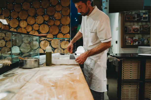 istock Pizza chef preparing the pizza dough at the restaurant 1287249493