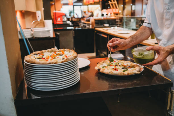 istock Pizza chef preparing pizza at the restaurant 1287249498