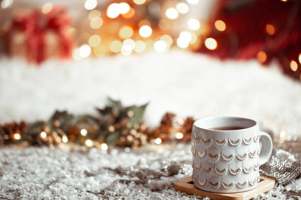 istock Cozy winter background with a beautiful cup on a blurred background with bokeh. 1287249600