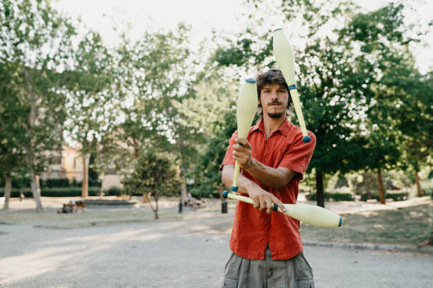 istock Young adult juggler training at the park 1287249671