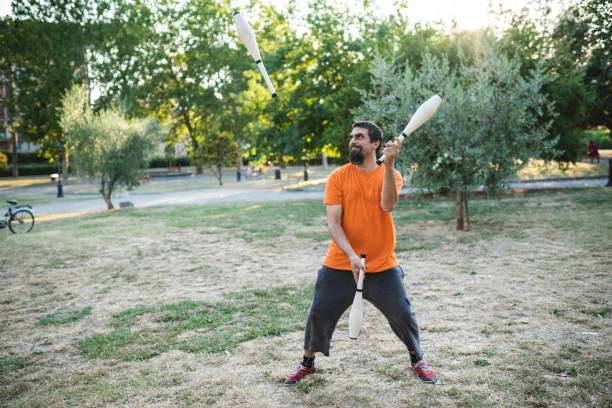 istock Young adult juggler training at the park 1287249678