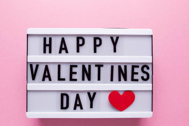 istock Box with the inscription Happy Valentine's Day on a pink background 1287250735