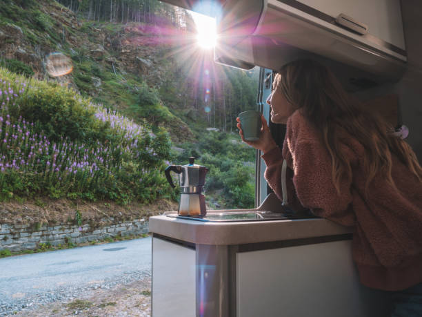 istock Woman enjoys fresh Italian coffee from her van 1287251326