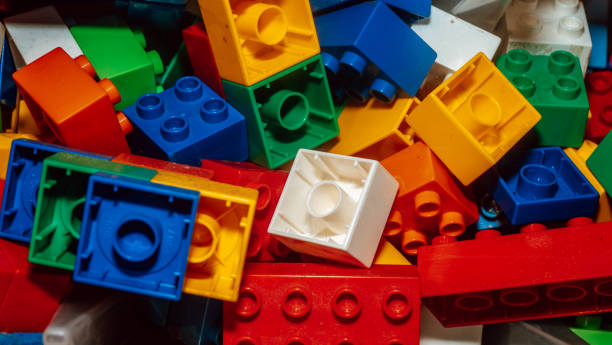 istock Multicolored plastic building blocks of the designer. Background of bright plastic building blocks. 1287251349