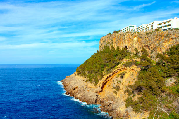 Hotels situated on the top of coastal mountains . Mallorca island  Punta de Sa Creu scenery