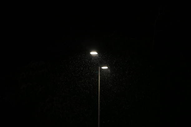 istock A light pole in the dark illuminating the rain 1287255547