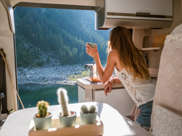 istock Woman enjoys fresh Italian coffee from her van 1287255609