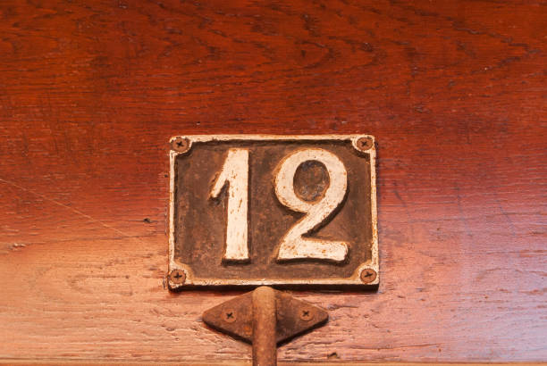 istock Old retro cast iron plate number 12 1287255628