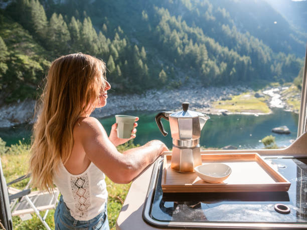 istock Woman enjoys fresh Italian coffee from her van 1287255962