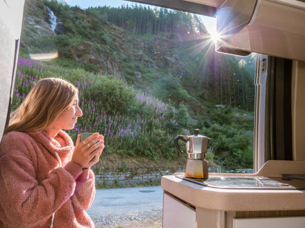 istock Woman enjoys fresh Italian coffee from her van 1287256090