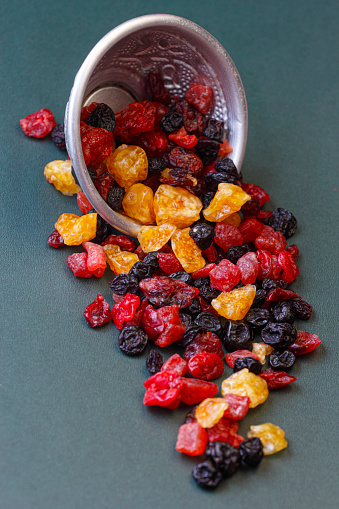 Pile of various dried tropical fruit isolated on white background with clipping path.