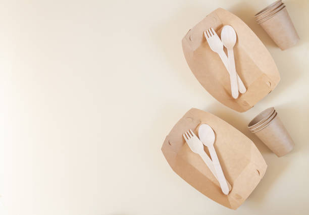 istock Zero waste tableware, plastic free concept, biodegradable paper plate, cutlery, cup on beige background top view 1287256206