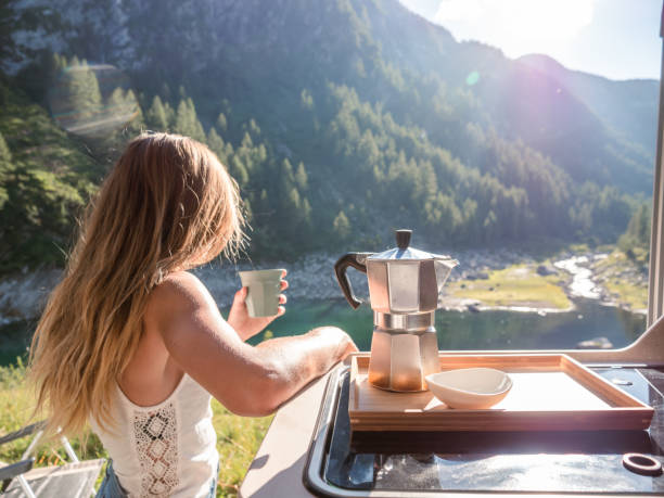 istock Woman enjoys fresh Italian coffee from her van 1287257077