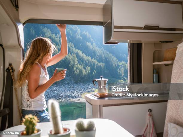 Woman Enjoys Fresh Italian Coffee From Her Van Stock Photo - Download Image Now - Motor Home, Lifestyles, Mini Van