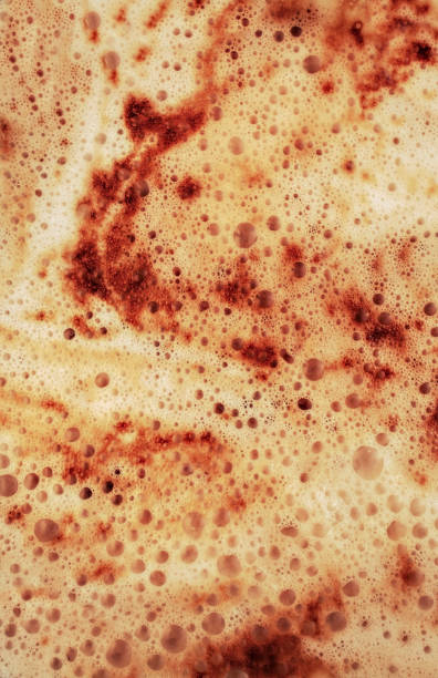 istock Vertical background of cappuccino foam close-up. 1287257328