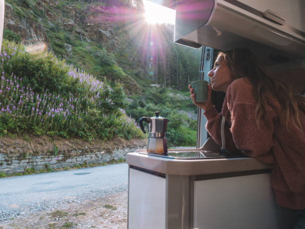 istock Woman enjoys fresh Italian coffee from her van 1287257500