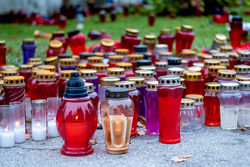 European day of the dead in the cemetery. All Saints day, celebration in the memory of the dead on the 1st and 2nd of November also known as All Hallows' Day, Hallowmas. Candles galore.