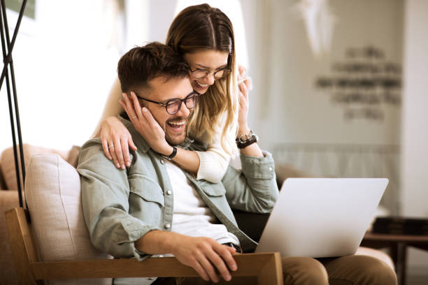 istock Young couple working from home on the laptop 1287257906