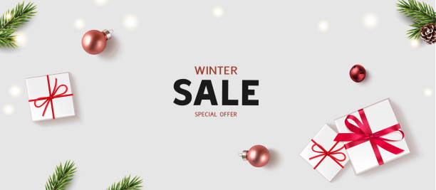 istock New Year and Christmas design template. Winter background with decorative red balls,  white lights and gift box. 1287258645