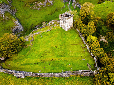 Aerial view of Peveril Castle ruins in Castleton in Peak District, England, UK