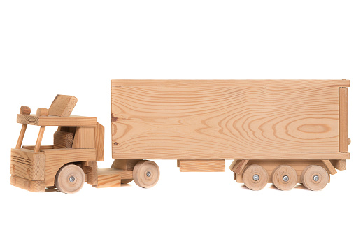 Wooden hand made toy truck isolated on a white background