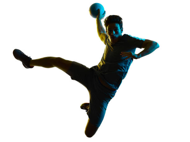 handball player  man  silhouette shadow isolated white background - sportsman looking at camera full length sport imagens e fotografias de stock