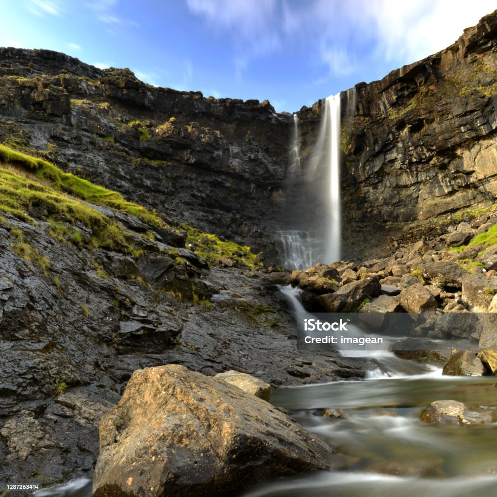 Fossa waterfall Fossa Waterfall on a sunny day taken with long exposure on Faroe Islands. Faroe Islands Stock Photo