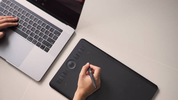 istock Hand and laptop computer. and mouse pad.On white background. 1287263731