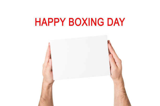 istock Happy boxing day. Box with white empty in male hands. White background 1287266312