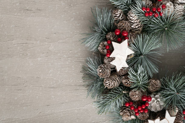 istock Part of Christmas wreath on light background. New year decor, copy space 1287266426