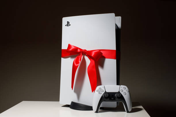 Sony PlayStation 5 Gift edition Riga, Latvia - November 23 2020: Sony PlayStation 5 game console on black background. Gift edition with red ribbon black friday deal 4k gaming stock pictures, royalty-free photos & images