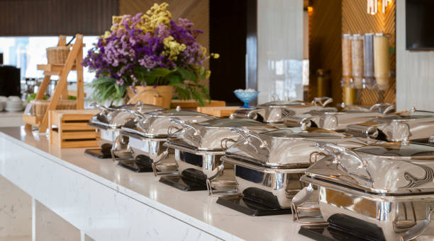 istock heating trays on buffet line ready for service. breakfast and lunch buffet food catering banquet in hotel or restaurant. 1287267688