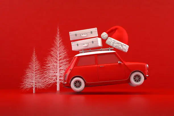 Photo of Christmas Travel Holiday Concept, Red Car, Red Background