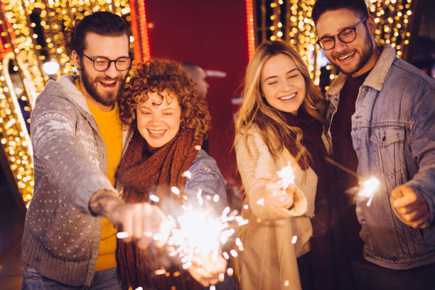 istock Celebrating New Year with sparklers 1287270831