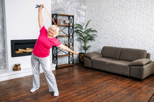 istock A senior woman is training at home 1287271675