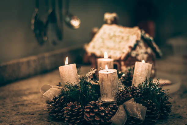 burning adwent wreath in christmas atmosphere stock photo