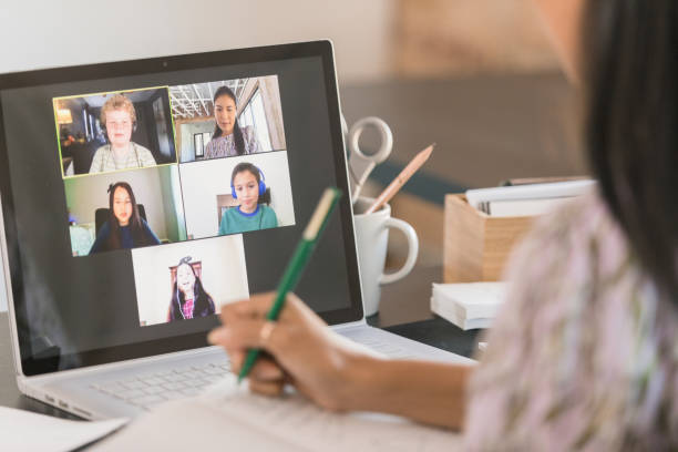 istock Diverse students listen as unrecognizable teacher gives lesson 1287276086