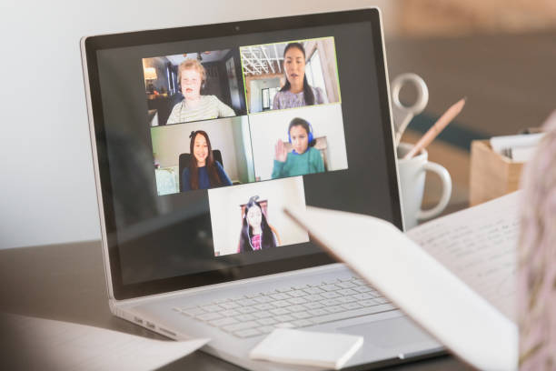 istock Students interact online with unrecognizable teacher during COVID-19 1287276123
