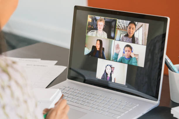 istock Diverse students raise hands to answer questions for teachers 1287276138