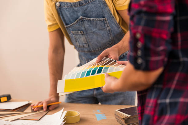 istock Choosing color swatches while renovating 1287276569
