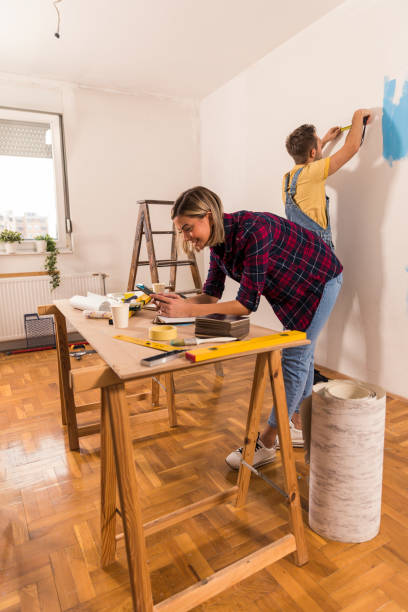 istock Taking inspiration online and measuring for decorations on the wall 1287277216