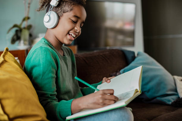 istock A little girl is writing homework 1287277256
