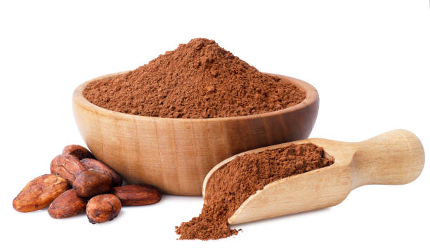 cacao powder in wooden bowl stock photo