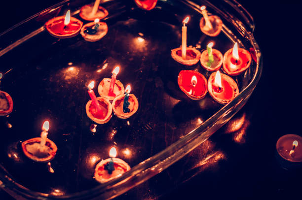 christmas tradition of nut shells floating on water surface, eastern Europe tradition with bokeh background