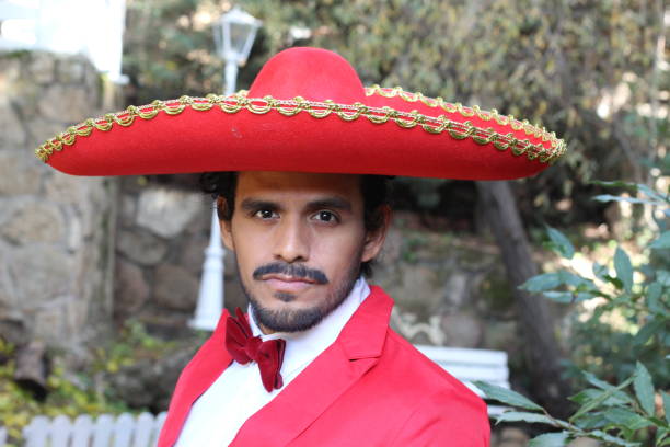 istock Handsome mariachi with red outfit 1287288275